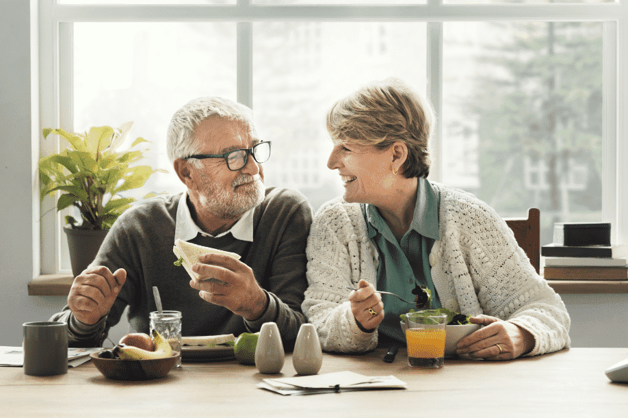 Man and woman sitting at the table enjoying breakfast