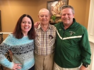 Group photo of resident and two family members