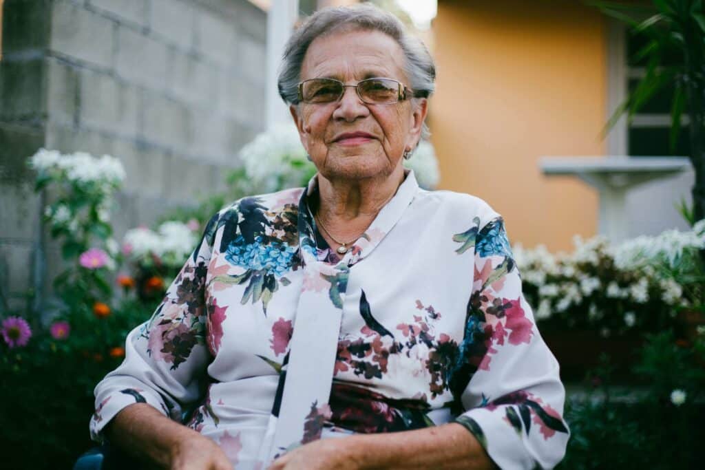 Photo of a woman sitting and smiling