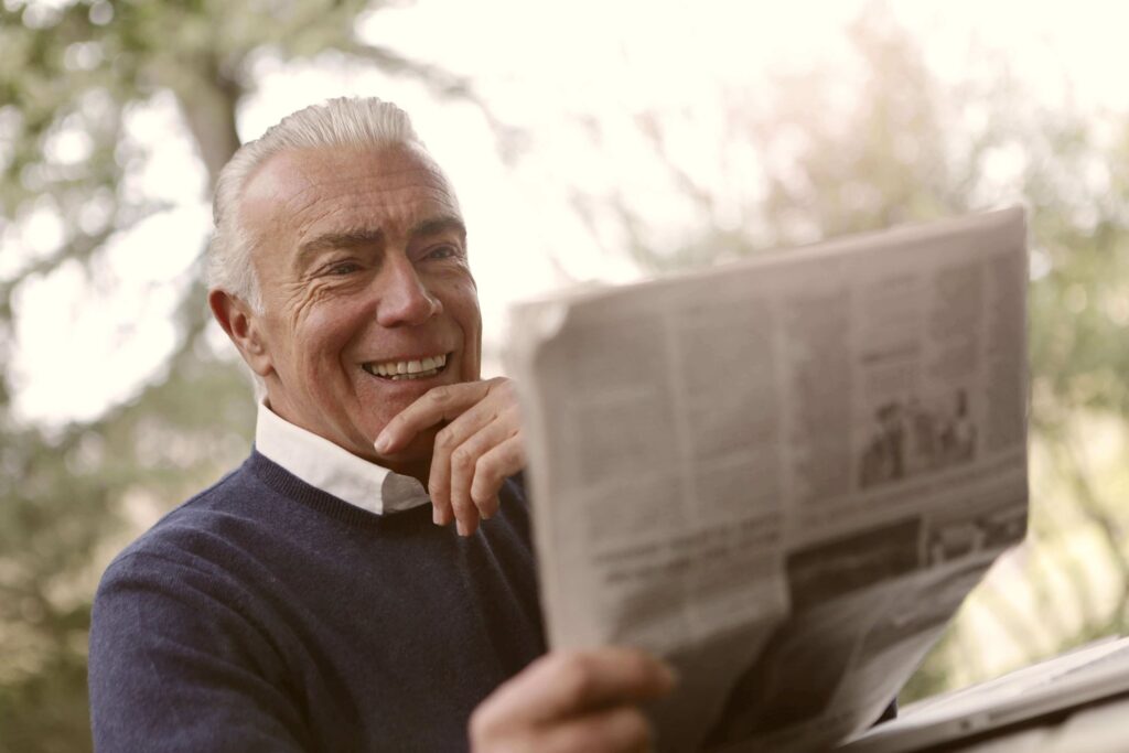 Man sitting and reading the newspaper