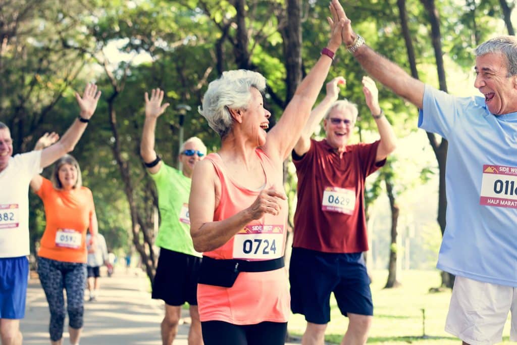 Group of men & women participating in a marathon