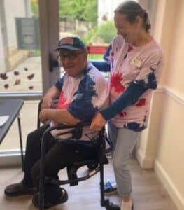 A couple wearing matching tie dye shirts at the Gardens of Germantown
