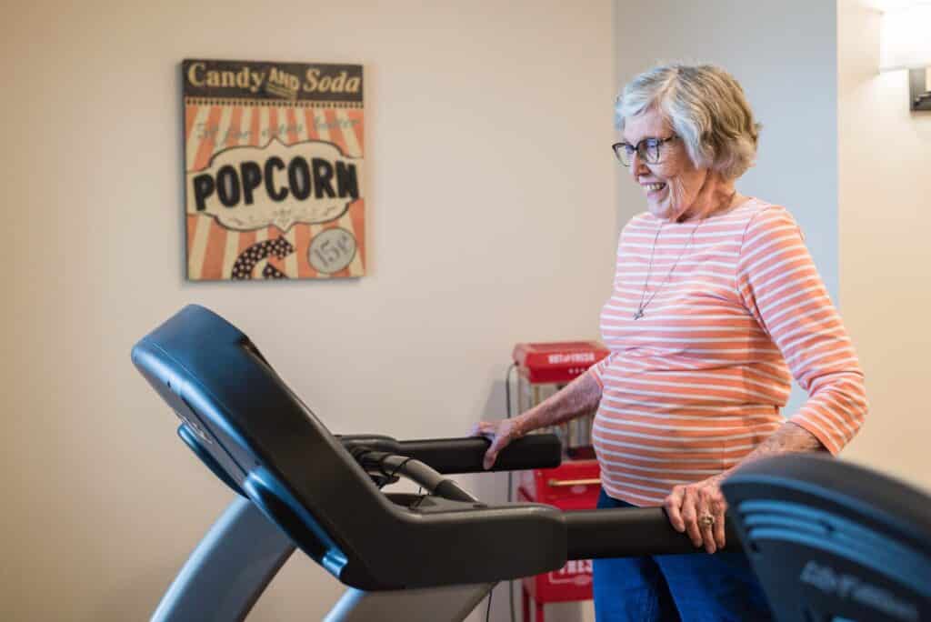 Photo of woman walking on treadmill