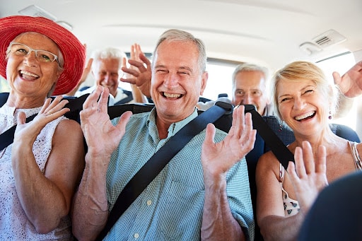 Group of men & woman riding in a vehicle