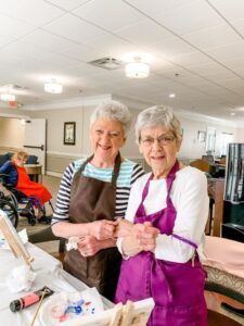 Photo of two women painting