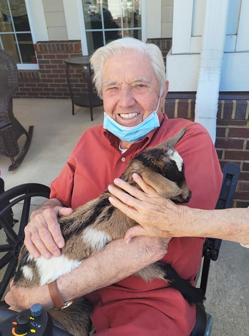 Resident holding a goat