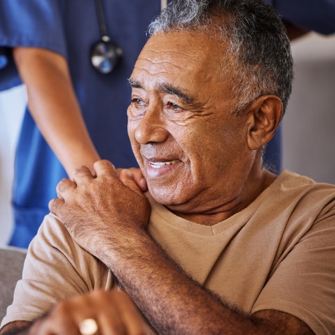 Photo of Nurse putting hand on resident shoulder