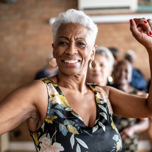 Photo of woman dancing and smiling
