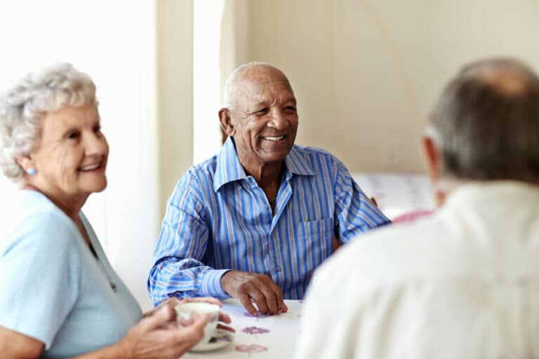 Photo of group sitting around socializing