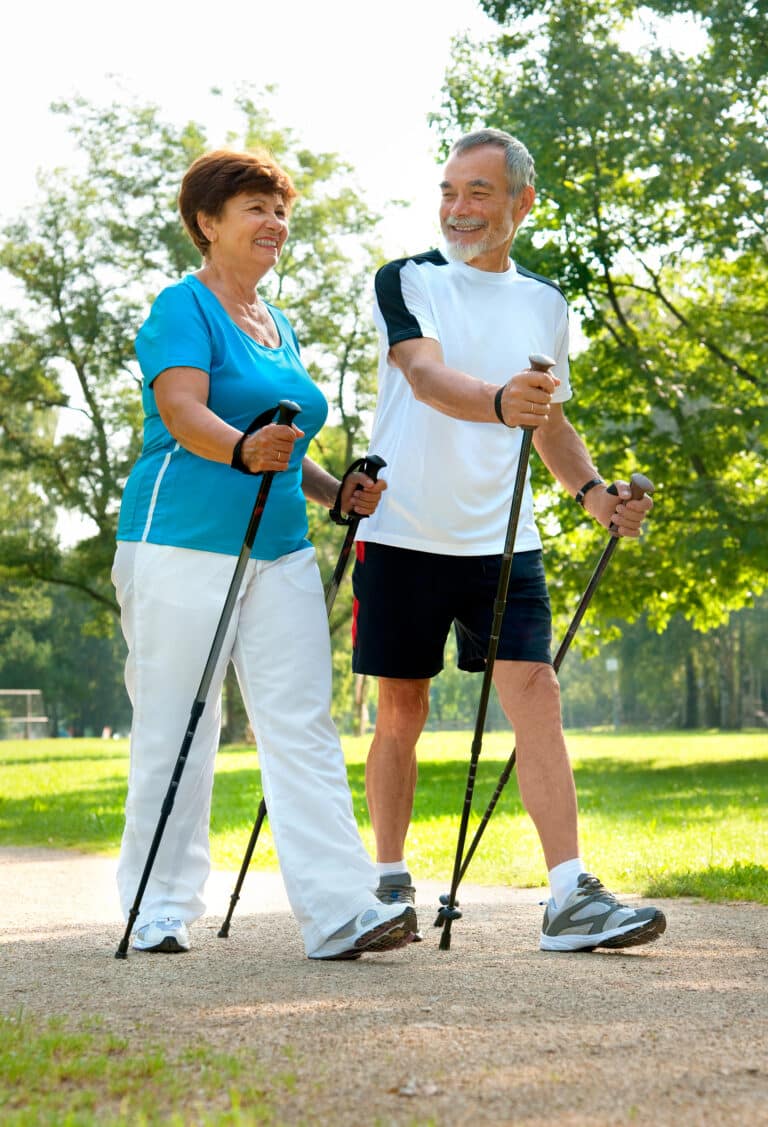 Seniors Walking with trekking poles