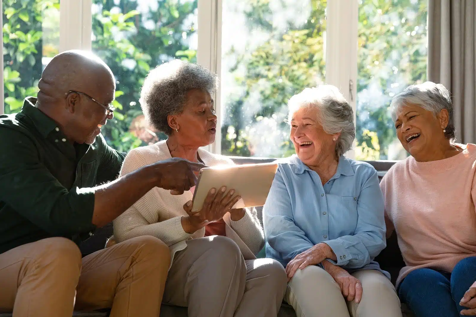 3 happy diverse senior women with man
