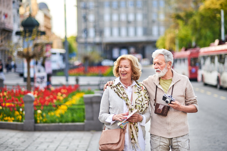 Senior couple traveling and exploring a new city