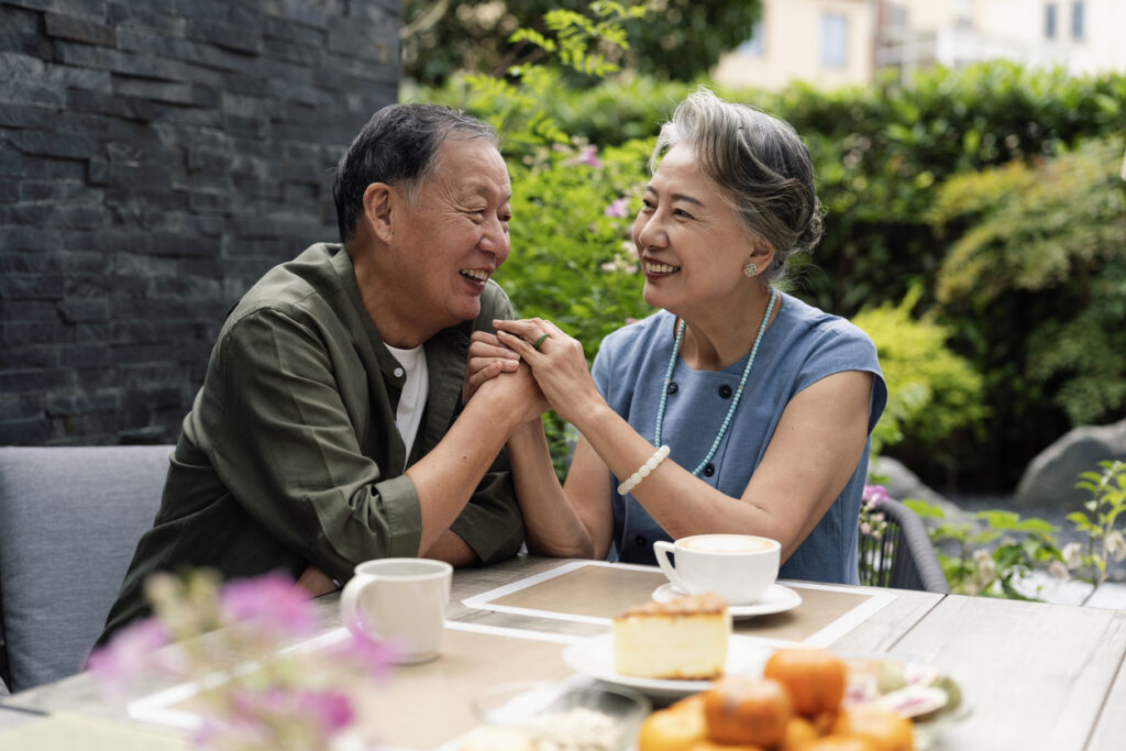 A senior couple enjoying tea together outside
