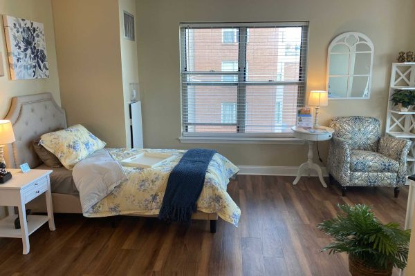 Furnished Model Apartment studio with light and nightstand