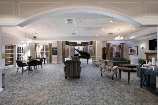 Common living area in retirement living with grand piano