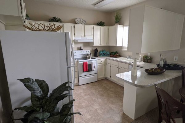 model kitchen with fridge, sink and stove