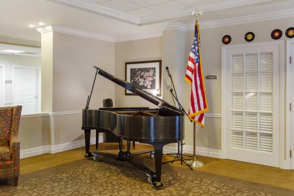 Piano room with seating