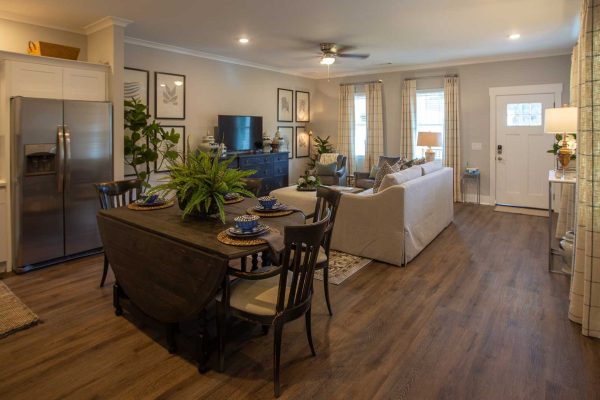 Furnished Apartment with dining table, sofas, and TV