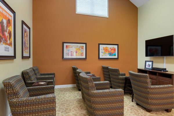 Movie room with TV and seating