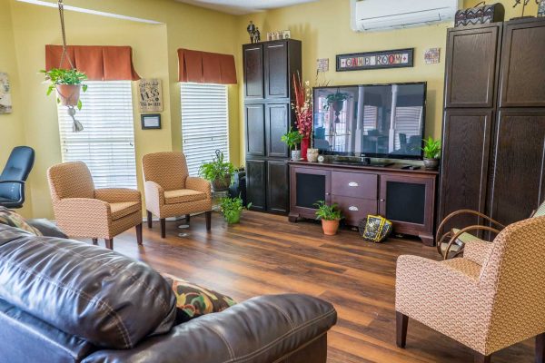 Community Living room with TV and sofa