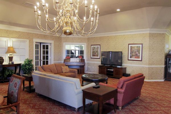 Community Living room with cuches and TV