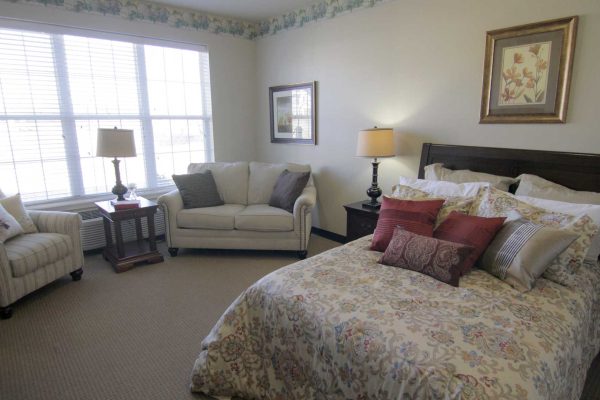 bedroom with bed and couches